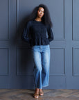Black Beauty Smocked Peplum Top