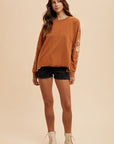 Annie Wear Embroidered Long Sleeve French Terry Top