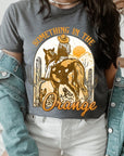 Something in the Orange Cowgirl Graphic Tee