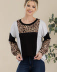 Celeste Full Size Leopard Color Block Exposed Seam T-Shirt