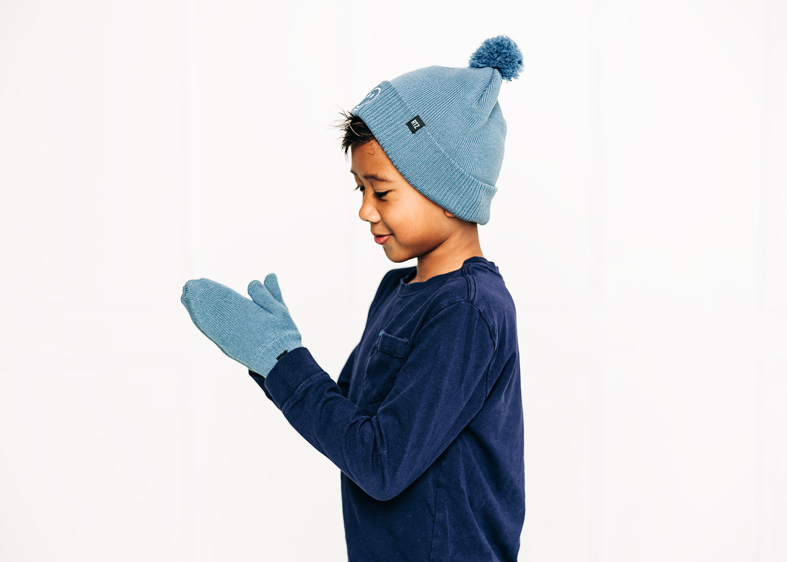 Blue Smiley Pom Pom Hat