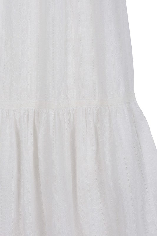 Lilou Embroidered white V neckline tiered dress