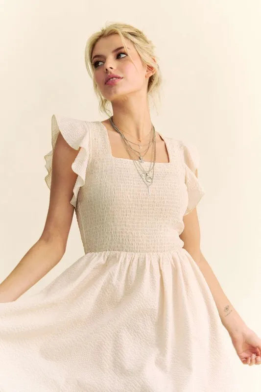 Davi & Dani Ruffled Cap Sleeve Smocked Mini Dress in Cream