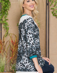 Celeste Full Size Animal Print Eyelet V-Neck Top