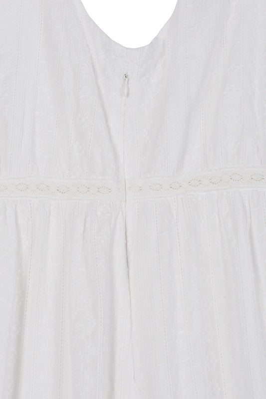 Lilou Embroidered white V neckline tiered dress