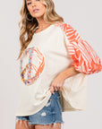 SAGE + FIG Peace Applique Patch with Zebra Print Contrast Top