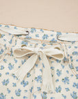 Floral Grommet Knot Waist Barrel Leg Jeans