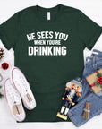 He Sees You When Your Drinking Graphic Tee