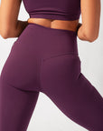 POPFLEX Full Size Crisscross Hourglass® Flared Leggings with Pockets - Winter Plum