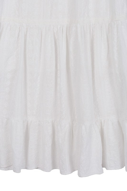 Lilou Embroidered white V neckline tiered dress