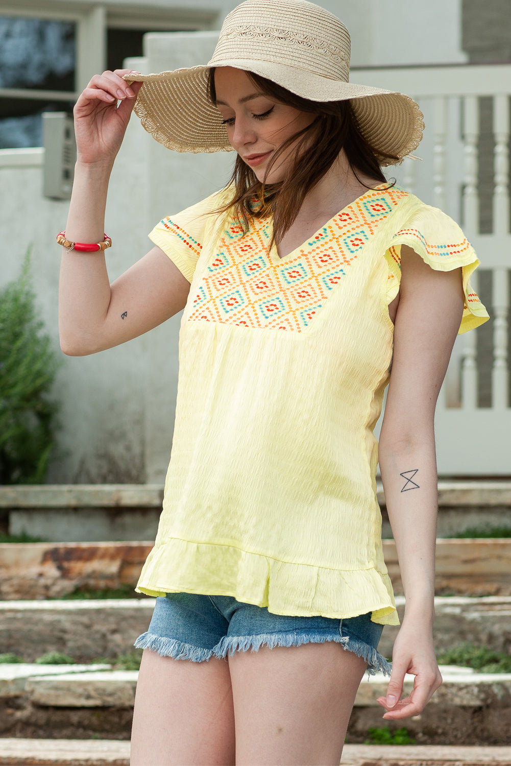 Embroidered V-Neck Ruffle Hem Top - Online Only