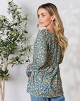 Heimish Full Size Floral Half Button Long Sleeve Blouse